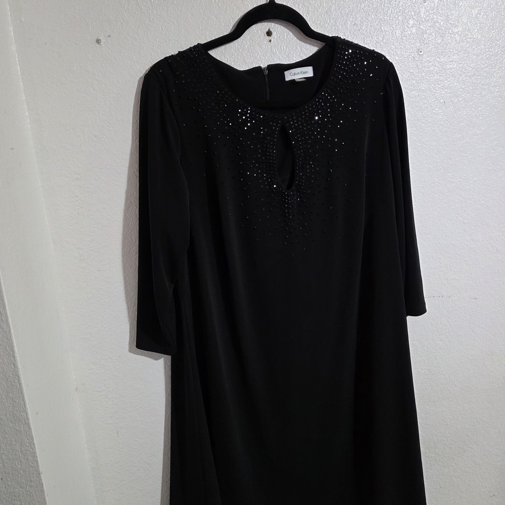 Elegant Black Dress with Embellished Neckline